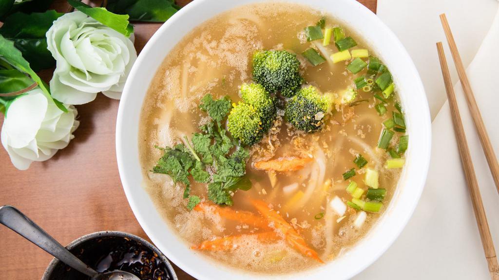 Tom Yum With Handmade Noodle Soup · Tom yum soup with handmade rice tapioca noodle. With ginger, onion, carrot, broccoli, cilantro, green onion, and fried garlic.
