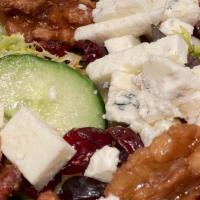 Gorgonzola · Mesclun lettuce, tomatoes, cucumbers, cranberries, candied walnuts and crumbled Gorgonzola c...