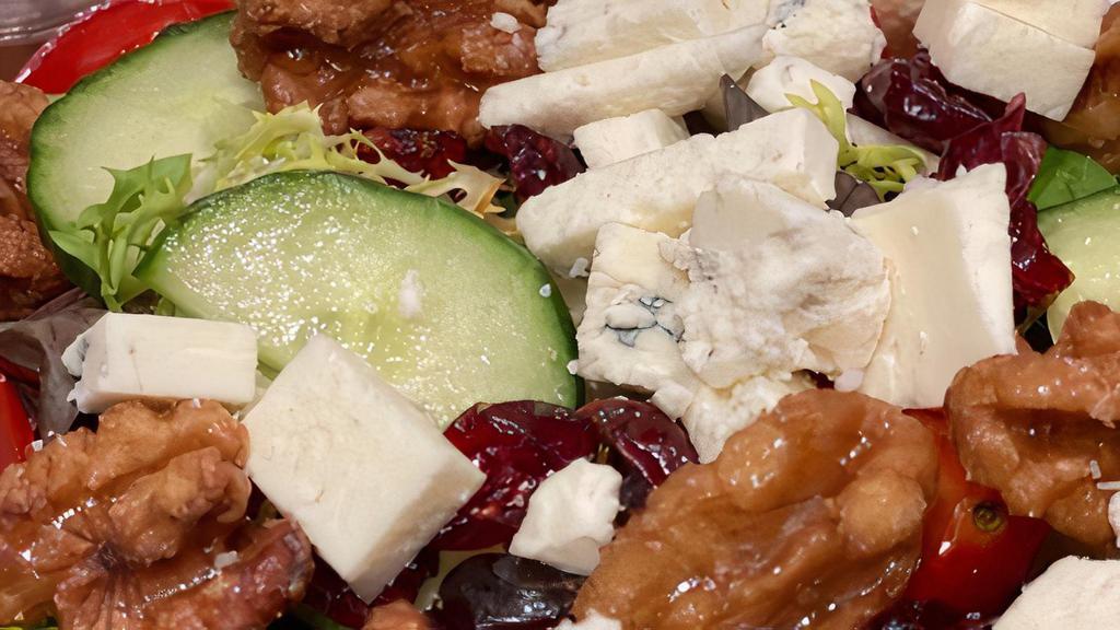Gorgonzola · Mesclun lettuce, tomatoes, cucumbers, cranberries, candied walnuts and crumbled Gorgonzola cheese served with raspberry vinaigrette.