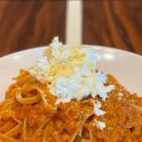 Fettuccine Bolognese & Ricotta · Rustic tomato meat sauce with a blend of beef & pork