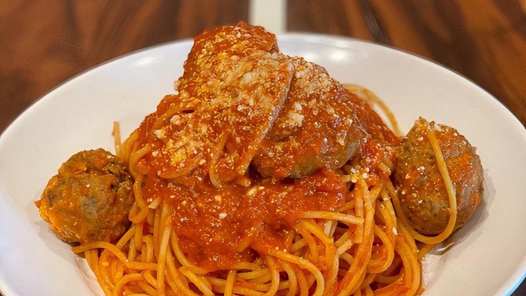 Spaghetti & Meatballs · Spaghetti with tomato sauce topped with Mozza’s homemade meatballs