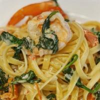 Tuscan Style Fettuccine · Shrimp, sun-dried tomatoes, spinach, lemon & garlic cream sauce