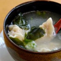 Gyoza Soup · Chicken based broth with three dumplings, seaweed, and scallion.