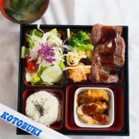 Steak Teriyaki Bento · baked steak served with chicken or tofu appetizer, rice, salad, in a traditional lunch box.