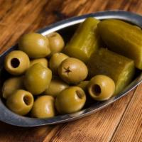 Israeli Pickles · Traditional cured cucumbers, olives, and peppers.