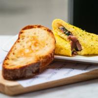 Chanson Omelette · Organic ham, baby spinach, gruyere, with grilled sourdough.