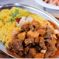 Picadinho · Pork or chicken sautéed with shrimp or clams served with home fries and rice.