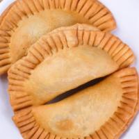 Empanadas · Fried pastry shell filled with beef or chicken.