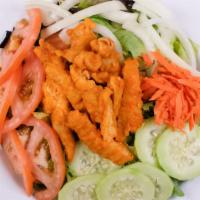 Buffalo Chicken Salad · Buffalo chicken strips served on top of a house salad and served with blue cheese dressing.