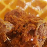 Chicken N Waffles · Savory and sweet, honey-dipped crispy chicken atop a belgian waffle, served w/butter & warm ...