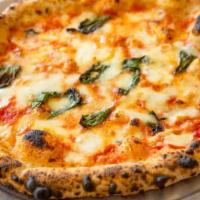 Margherita Pizza · Organic Italian tomato sauce, fior di latte, grana padano and basil.