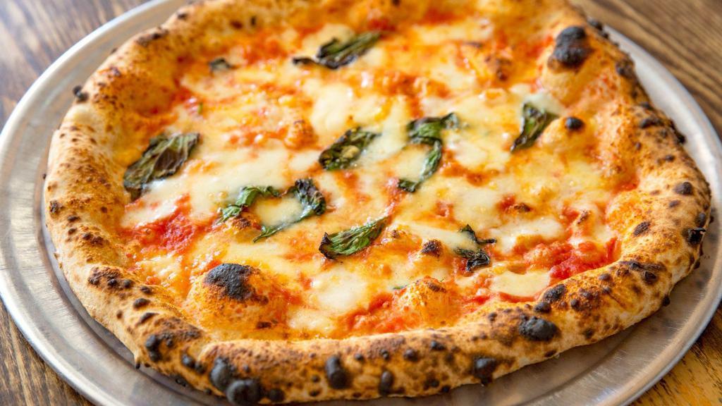 Margherita Pizza · Organic Italian tomato sauce, fior di latte, grana padano and basil.