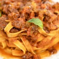 Fettuccine Al Ragu · Beef ragu, pecorino Romano, basil