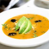 Tortilla Soup · Spicy tomato broth topped with tortilla and cheese.