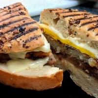 The Cure · Egg, sausage, American cheese, and a hash brown on a grilled bagel.