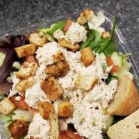 Lucy'S Chicken Salad · Mixed greens topped with a scoop of homemade chicken salad, tomato, cucumber and homemade cr...