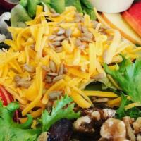 Angry Fruit Salad · Mixed greens topped with split red grapes, sunflower seeds, sliced apple, avocado, walnuts a...