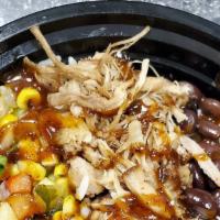 Caribbean Jerk Pork Bowl · Slow roasted pulled pork with black beans, cilantro corn relish and pineapple mango salsa to...