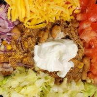 Loaded Chili Rice Bowl · Homemade White Chicken Chili with diced tomatoes, red onion, lettuce, shredded cheddar chees...