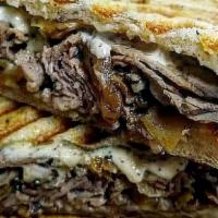 French Onion Roast Beef · Hot roast beef, melted Swiss cheese, caramelized onions and homemade garlic aioli on grilled...
