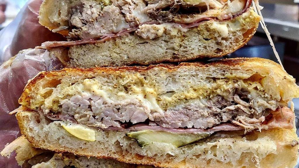 Cuban · Slow roasted pork, hot ham, melted Swiss cheese, sliced pickles, garlic aioli and brewpub mustard on grilled stretch bread.

*If stretch bread is not available, Focaccia bread will automatically be substituted.
