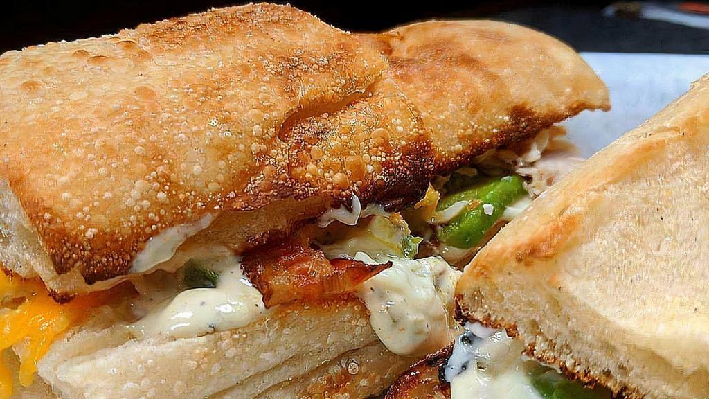 Albakurkey Turkey - Whole Size · Hot roasted turkey, bacon, avocado, melted cheddar cheese and green Chile mayo on stretch bread. *Stretch bread availability varies. Sandwich will automatically be substituted to White Sub Roll if we're out of Stretch bread.