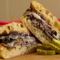 The Stallion - Whole Size · Hot roast beef, melted Swiss cheese, homemade garlic butter on toasted Stretch Bread. *Stret...