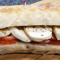 Half Mozzarella Caprese · Fresh mozzarella, tomato, olive oil, balsamic vinegar, and oregano on toasted stretch bread
...