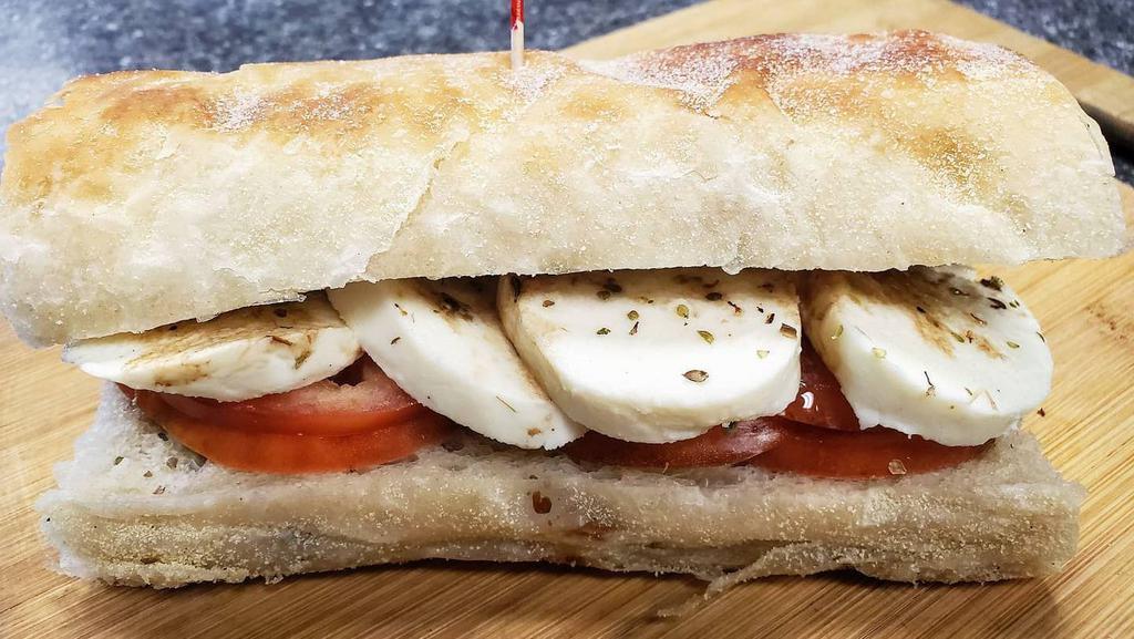 Half Mozzarella Caprese · Fresh mozzarella, tomato, olive oil, balsamic vinegar, and oregano on toasted stretch bread



*Stretch bread availability varies. Sandwich will automatically be substituted to White Sub Roll if we're out of Stretch bread.