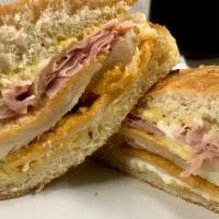 The Prima Donna - Whole Size · Breaded chicken cutlet, hot ham, melted Swiss, mayo and honey mustard on toasted homemade fo...