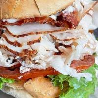 The Orange Pack - Whole Size · Club sandwich with your choice of roasted turkey or breaded chicken with bacon, lettuce, tom...