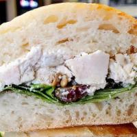 Leah'S Sunflower Chicken Salad Sandwich - Half Size · Homemade chicken salad, lettuce, split grapes and sunflower seeds on stretch bread. *Stretch...