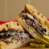 The Stallion - Half Size · Hot roast beef, melted Swiss cheese, homemade garlic butter on toasted Stretch Bread. *Stret...
