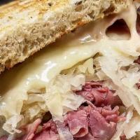 The Ellis Island Reuben - Half Size · Hot corned beef, melted Swiss, sauerkraut and Russian dressing on toasted rye bread.