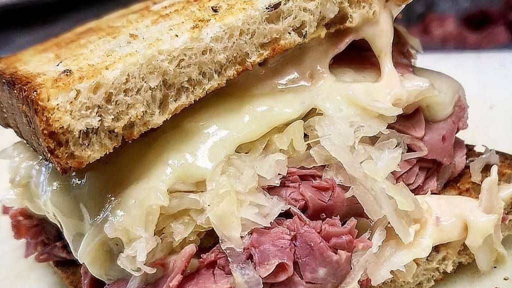 The Ellis Island Reuben - Half Size · Hot corned beef, melted Swiss, sauerkraut and Russian dressing on toasted rye bread.