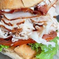 The Orange Pack - Half Size · Club sandwich with your choice of roasted turkey or breaded chicken with bacon, lettuce, tom...