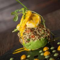 Palta Rellena · Stuffed avocado with shrimp, quinoa, cucumber, red pepper, mint, olive oil, cherry and tomat...