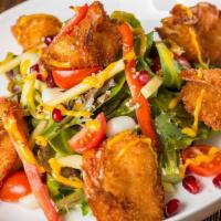 The Inkan Salad · Panko shrimp, mix greens, pomegranate, mango, corn, cherry tomatoes, passion fruit vinaigret...