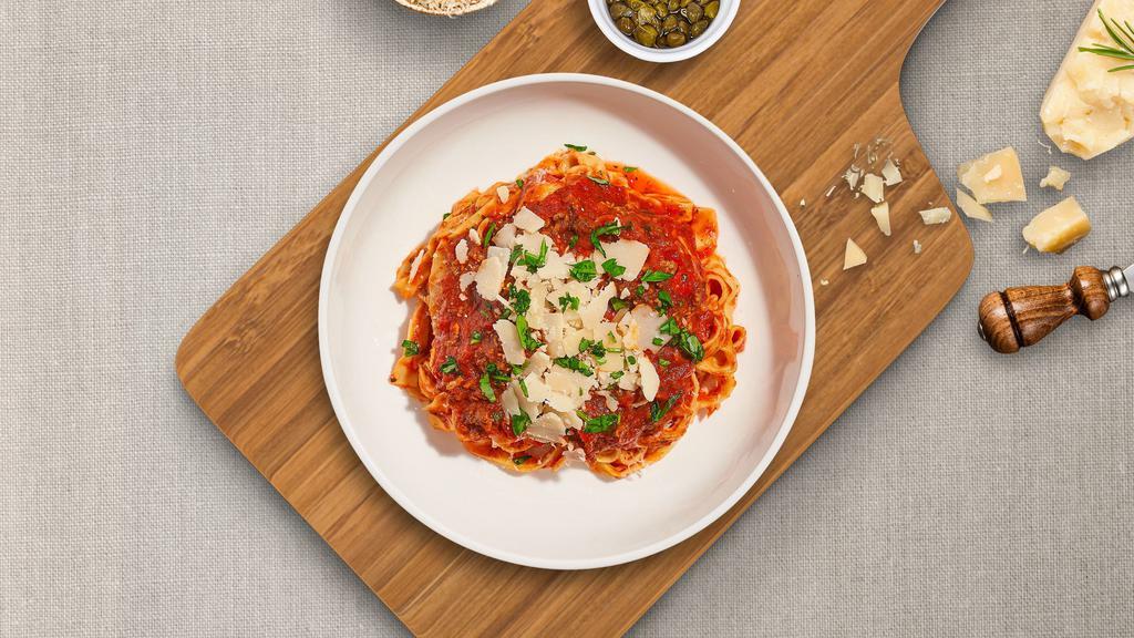 Bolognese Bliss Pasta (Fettuccine) · Ground beef cooked in classic flavorful marinara sauce and served with Fettuccine.