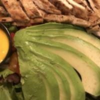 Avocado Chicken Salad · Dairy free. Marinated chicken breast over mixed greens with, tomato, avocado and fresh fruit...