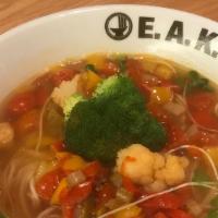 V-Garden Ramen · Vegan. Vegetable broth, shio tare and thin wavy noodles. Red and yellow bell peppers. Tomato...