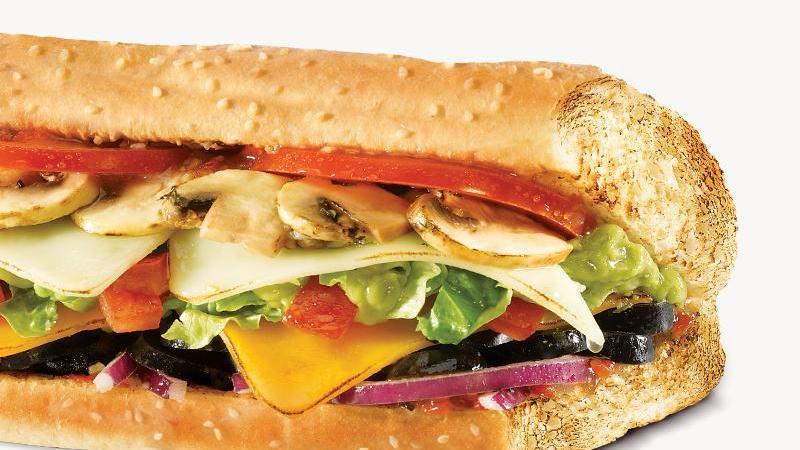 Veggie Guacamole Sub · Provolone cheese, cheddar cheese, cucumbers, guacamole, tomato, black olives, fresh mushrooms, red onion, shredded lettuce, green peppers and red wine vinaigrette.