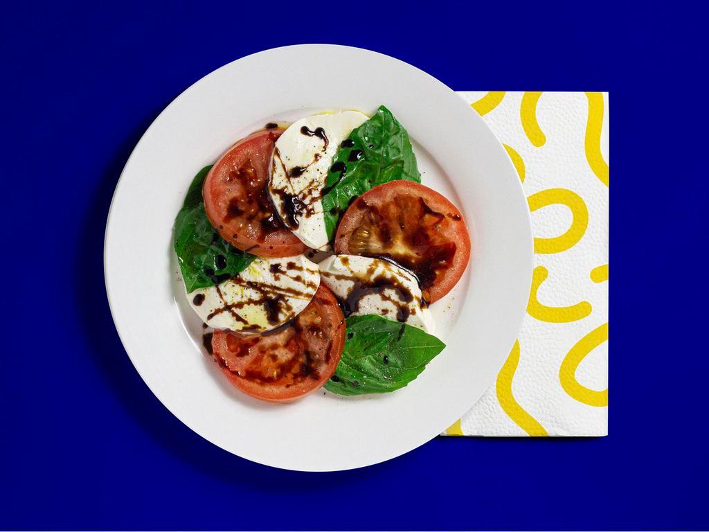 Caprese Salad · Fresh mozzarella, tomato, basil, balsamic vinegar, and olive oil.