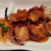 Yakitori · Chicken and onion on skewers.