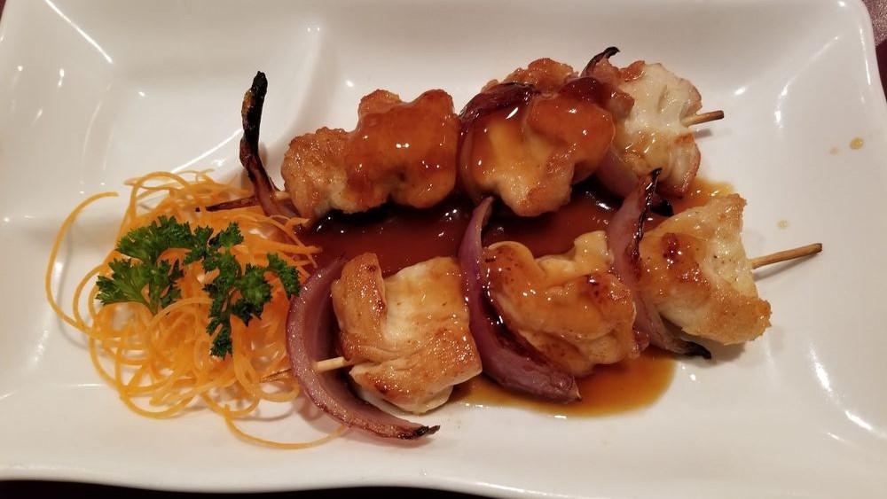 Yakitori · Chicken and onion on skewers.