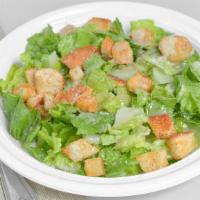 Caesar Salad · Romaine lettuce, homemade croutons and tossed In our Caesar dressing.