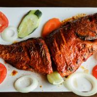 Tandoori Whole Fish · Whole trout broiled in clay oven & served with vegetables.