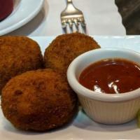 Vegetable Cutlet · Crumb fried vegetable cutlets served with spicy hot sauce.