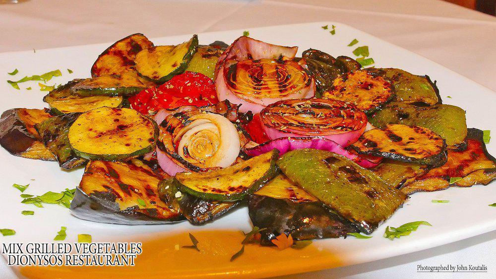 Greek Salad · Lettuce, Tomato, Cucumber, Onion, Feta, Olives, Peppers, Olive Oil and Vinegar