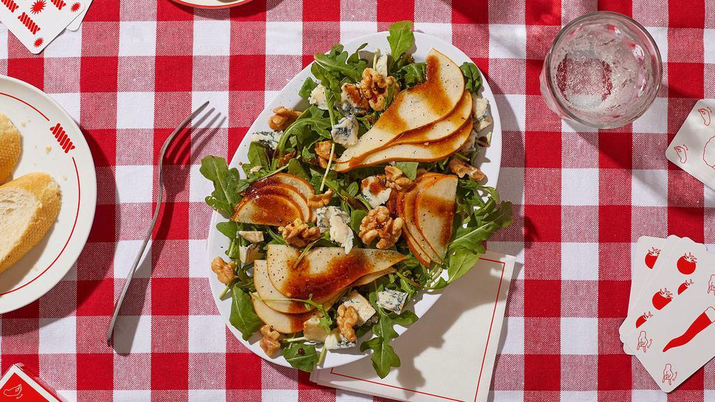 Pear And Gorgonzola Salad · Arugula with sliced pear, walnuts, and gorgonzola cheese with a balsamic viniagrette.